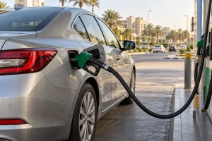 Silver car refuelling at a petrol station in Dubai.